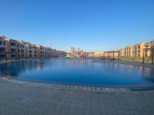 a large pool of blue water in a street at Villa makani فيلا مكاني in Ain Sokhna