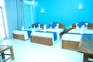 SP Tourist Hotel Jaffna客房内的一张或多张床位