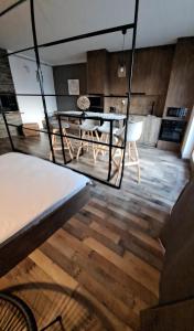 a dining room with a glass table and chairs at The World Apartament II in Târgu-Mureş