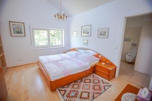 Postel nebo postele na pokoji v ubytování Privatzimmervermietung Margit + 26 fotografií