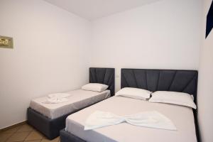 Postel nebo postele na pokoji v ubytování Koa Hotel