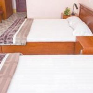 Postel nebo postele na pokoji v ubytování Khách sạn Ngân hàng - Bank Hotel