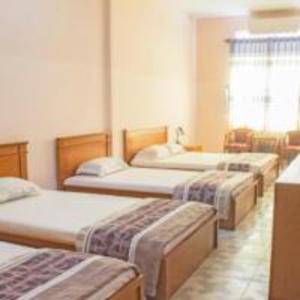 Postel nebo postele na pokoji v ubytování Khách sạn Ngân hàng - Bank Hotel