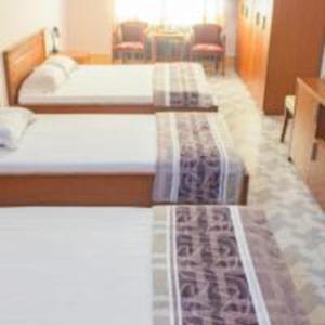 Postel nebo postele na pokoji v ubytování Khách sạn Ngân hàng - Bank Hotel