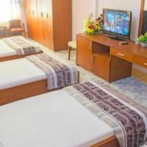 Postel nebo postele na pokoji v ubytování Khách sạn Ngân hàng - Bank Hotel