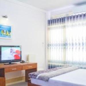 Postel nebo postele na pokoji v ubytování Khách sạn Ngân hàng - Bank Hotel