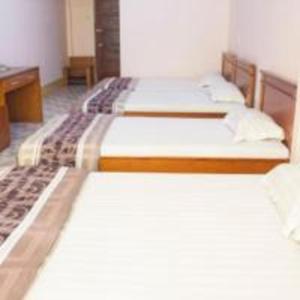 Postel nebo postele na pokoji v ubytování Khách sạn Ngân hàng - Bank Hotel