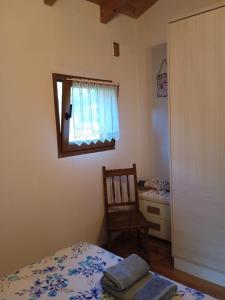 Postel nebo postele na pokoji v ubytování Casa rural en Asturias a orillas del río Narcea puerta de Somiedo