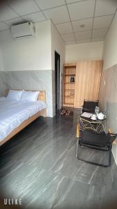 Postel nebo postele na pokoji v ubytování Ánh Mai Hotel