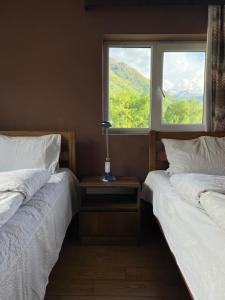 Rúm í herbergi á Guest House 15