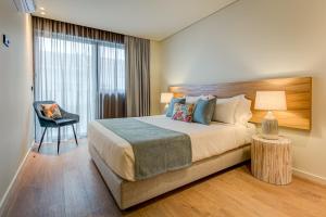 Blissful Suites Porto by gaiarooms客房内的一张或多张床位