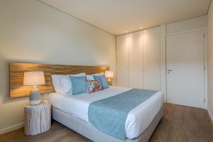 Blissful Suites Porto by gaiarooms客房内的一张或多张床位