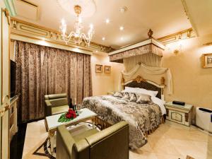 Restay Nagasaki Club (Adult Only)客房内的一张或多张床位