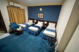 Postel nebo postele na pokoji v ubytování Al Barakah Mawaddah Hotel