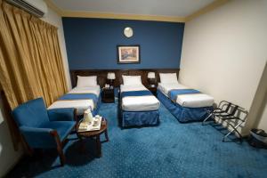 Postel nebo postele na pokoji v ubytování Al Barakah Mawaddah Hotel