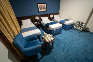 Postel nebo postele na pokoji v ubytování Al Barakah Mawaddah Hotel