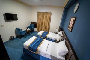 Postel nebo postele na pokoji v ubytování Al Barakah Mawaddah Hotel
