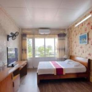 Postel nebo postele na pokoji v ubytování Khách sạn Ngân hàng - Bank Hotel