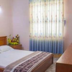 Postel nebo postele na pokoji v ubytování Khách sạn Ngân hàng - Bank Hotel