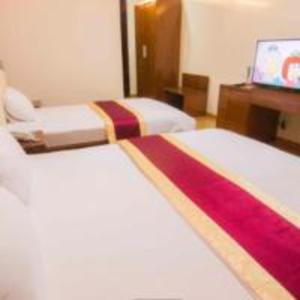 Postel nebo postele na pokoji v ubytování Khách sạn Ngân hàng - Bank Hotel