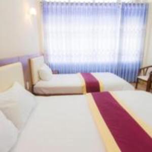 Postel nebo postele na pokoji v ubytování Khách sạn Ngân hàng - Bank Hotel