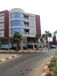 a large building on the side of a street at RESIDENCE SOUKHAINA AGADIR MAROC in Agadir