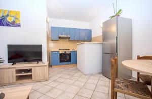 Kuchyň nebo kuchyňský kout v ubytování Apartman Natura