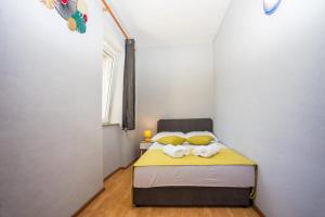 Postel nebo postele na pokoji v ubytování Apartman Natura