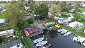 an aerial view of a marina with boats in the water at Camping Kleine Belterwijde, Haven Chalet in Belt-Schutsloot