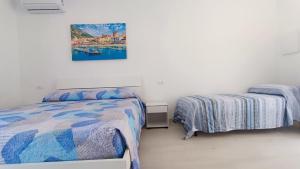Postel nebo postele na pokoji v ubytování Passariello