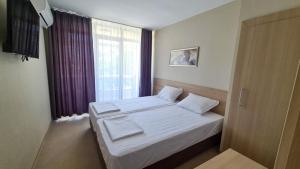 Postel nebo postele na pokoji v ubytování St. Sofia Beach Hotel + 18 fotografií