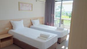 Postel nebo postele na pokoji v ubytování St. Sofia Beach Hotel