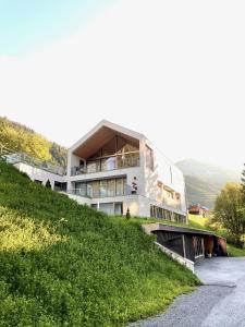 a building on the side of a hill at Omaela Apartments in Sankt Anton am Arlberg