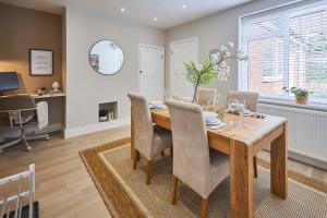 a dining room with a wooden table and chairs at Host & Stay - South Riggs in Bedlington