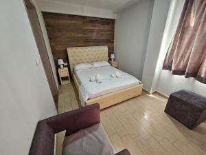 Postel nebo postele na pokoji v ubytování Hotel Pini