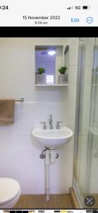 a bathroom with a sink and a toilet at STUDIO IN BONDI in Sydney