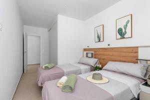 Postel nebo postele na pokoji v ubytování Tokai residences Casa Arco Iris + 23 fotografií