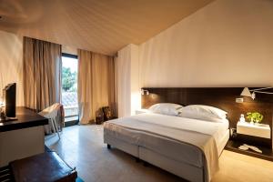Ramo d'Aria Etna Boutique Hotel tesisinde bir odada yatak veya yataklar