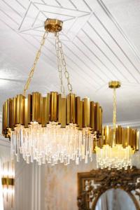 a chandelier hanging from a ceiling in a room at 1LSR - High-End Luxury 2 Bed Designer Apartment in London