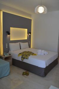 A bed or beds in a room at Ammos Apartments