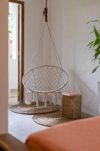 a hanging basket chandelier in a living room at NETS Cowork & Colive in Ahangama