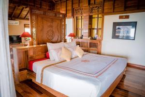 Tempat tidur dalam kamar di Belvedere Tam Dao Resort