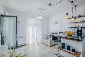 a kitchen and living room with a table and a couch at Casa Rose in Novigrad Istria +43 photos