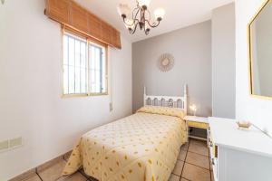 Łóżko lub łóżka w pokoju w obiekcie Casa Rural La Buganvilla
