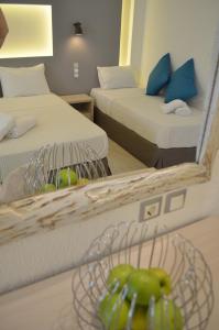 A bed or beds in a room at Ammos Apartments