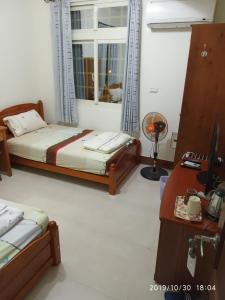 Postel nebo postele na pokoji v ubytování Xiang Pin Yuan Homestay