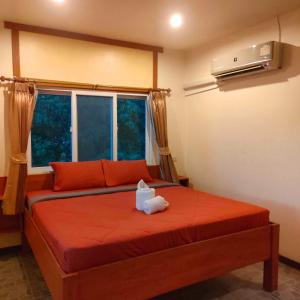 En eller flere senge i et værelse på Guesthouse and Restaurant Ratatouille