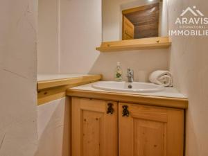 a bathroom with a sink and a mirror at Appartement Le Grand-Bornand, 4 pièces, 8 personnes - FR-1-391-92 in Le Grand-Bornand