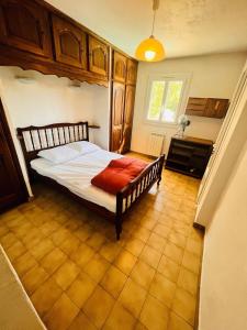 a bedroom with a large bed in a room at Escale Douceur d'Estérel in Saint-Raphaël