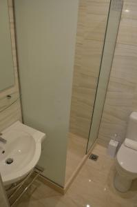 A bathroom at Ammos Apartments